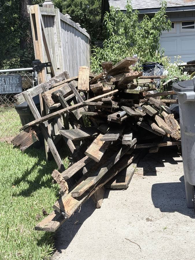 Old deck lumber loaded on a trailer for removal